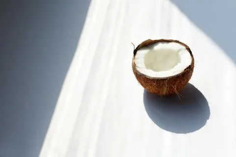 Half of coconut closeup on a white background Stock Photos