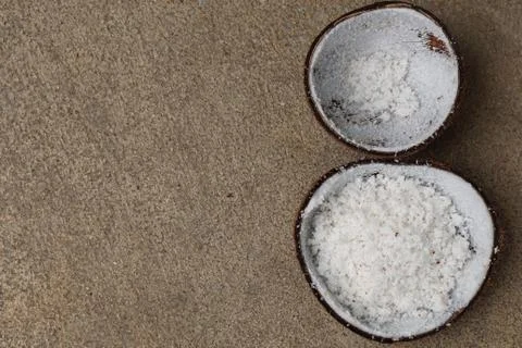 Half of coconut shell after grated by coconut grater Stock Photos