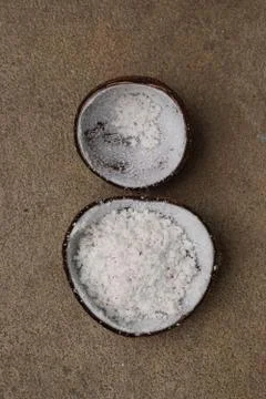 Half of coconut shell after grated by coconut grater Stock Photos