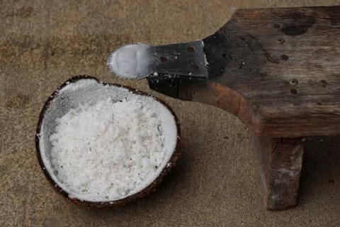Half of coconut shell with coconut grater Stock Photos