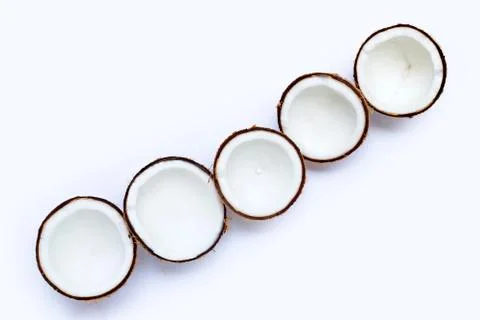 Half coconuts on white background. Stock Photos