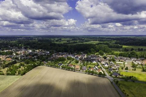 A half-collapsed barn in a field Stock Photos