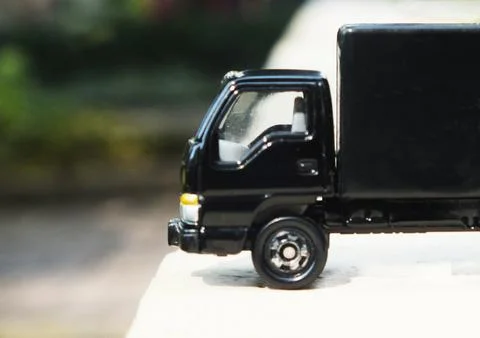 Half composition view of a black lorry toy truck Stock Photos