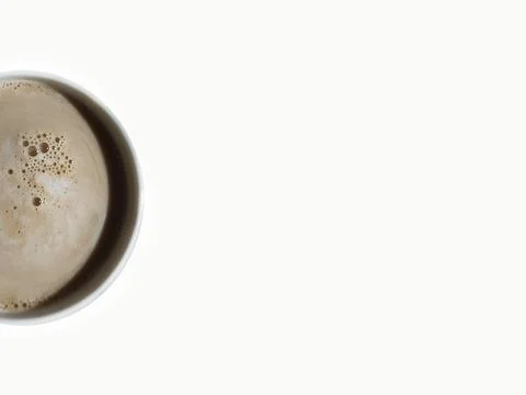 Half a cup of coffee on a white background, top view, copy space Stock Photos