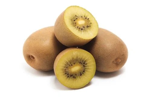 Half cut and two whole fresh organic golden kiwi delicious fruit side view .. Stock Photos