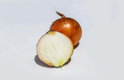 Half cut onion on white background Stock Photos