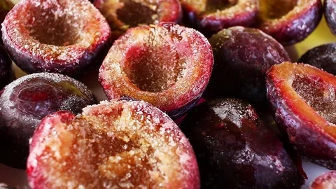 Half cut plum texture pirple healthy fruits on rotating plate Stock Footage 110612354