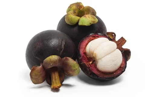 Half cut sliced and two whole fresh organic mangosteen delicious fruit isol.. Stock Photos
