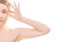 The half of the cute woman face on the white background Photo
