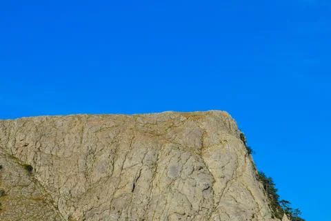 Half-divided view of a mountain and sky Stock Photos