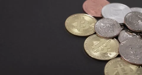 Half Dollar and Dollar coins on top of Bitcoin and Ethereum coins. Stock Footage 158654397