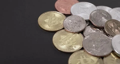 Half Dollar and Dollar coins on top of Bitcoin and Ethereum coins. Stock Footage 158654409