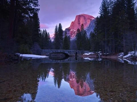 HALF DOME REFLECTING IN THE MERCED RIVER Stock Photos