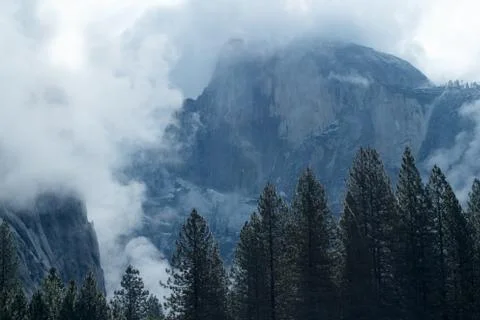 Half Dome surrounded by clouds Stock Photos