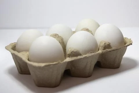 Half a dozen white eggs in a pack.,isolated ,on white background Stock Photos