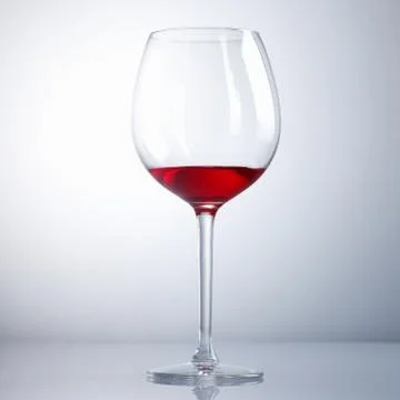 Half drunk wine glass Stock Photos