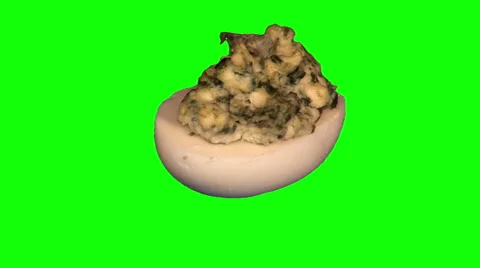 Half of egg stuffed with fried champignons and spinach Stock Footage 47588614