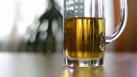 Half empty beer mug on table changed to empty Stock Footage 77570886