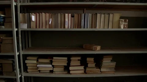 Half empty shelves with dusty books Stock Footage 77337888