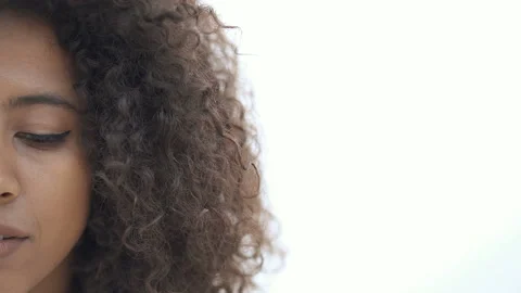 Half face portrait of afro american woman outdoors. No emotional. Stock Footage 107310020