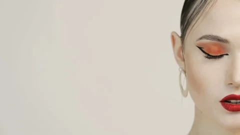 Half face of  woman in frame. Red lipstick. Perfect facial skin. Stock Footage 121337117