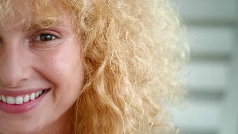 Half face of young curly redhead millennial brown-eyed woman with insightful Stock Footage 216024036