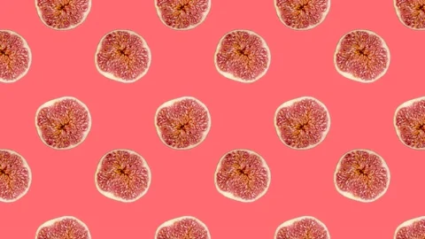 A half of fig in animated grid seamless loop pattern on a coral background Stock Footage 222321411