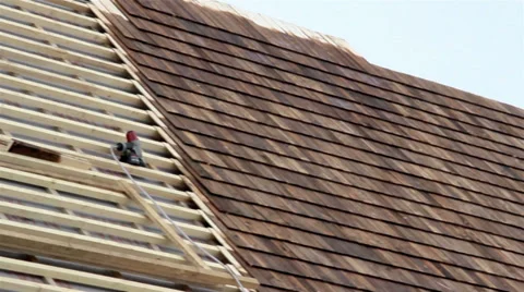 Half finished pine tared cedar wooden shingle roof Stock Footage 32328586