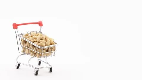 Half frame. Macro shooting of supermarket trolley filled with cashew nuts Stock Footage 100334386