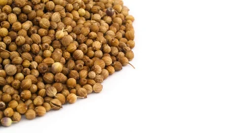 Half frame or circle shaped coriander seeds heap in top left corner.  Stock Footage 96453055