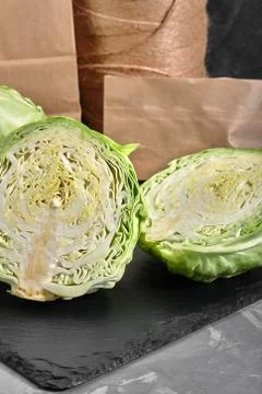 Half of fresh cabbage on dark background Stock Photos