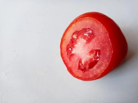 Half of fresh cherry tomato isolated on white background Stock Photos