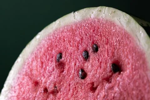 A half of fresh watermelon on dark background. Close-up macro photo. Fresh fr Stock Photos