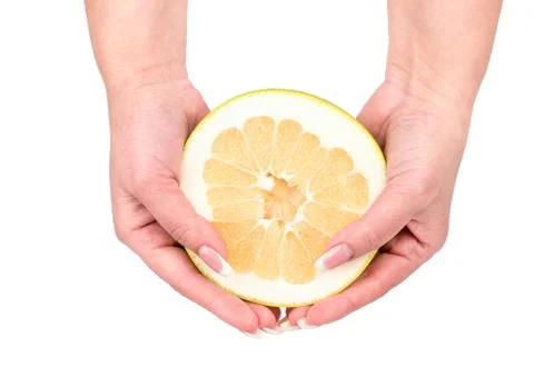 Half fruit oroblanco in hands Foto stock