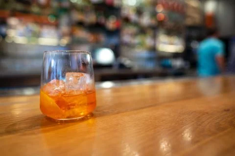 Half full empty spritz cocktail drink on counter in bar Stock Photos
