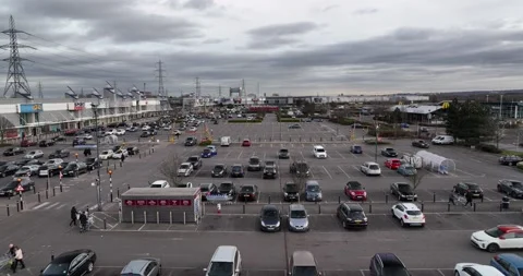 Half full large parking lot in front of huge shopping park in suburbs Video stock 170911280
