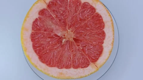 Half a grapefruit is rotating. Stock Footage 331032744