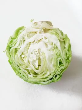 Half of green cabbage on white background Stock Photos