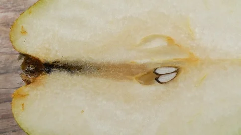 Half green pear close up Stock Footage 102182697