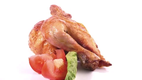 Half Grilled Chicken on a turntable isolated on white background Stock Footage 221267531