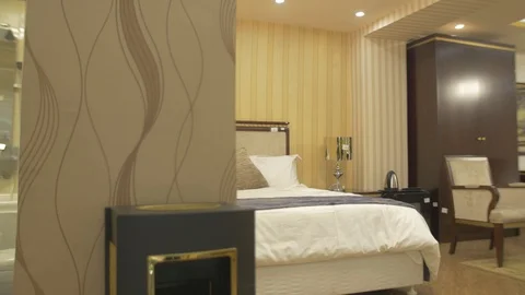 Half half display of a bathroom and a bed room Stock Footage 97512478