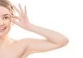 The half of the happy woman face on the white background Photo