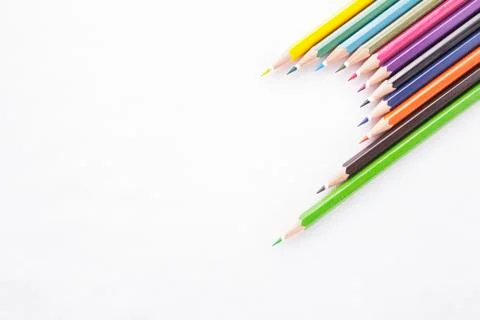 Half Heart shape made of colored pencils on white background Stock Photos