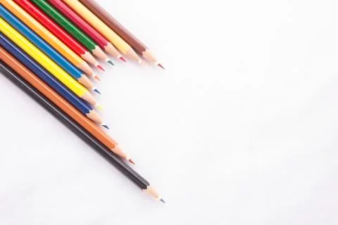 Half Heart shape made of colored pencils on white background Stock Photos