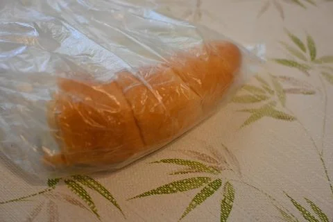 Half kifli in a plastic bag Stock Photos