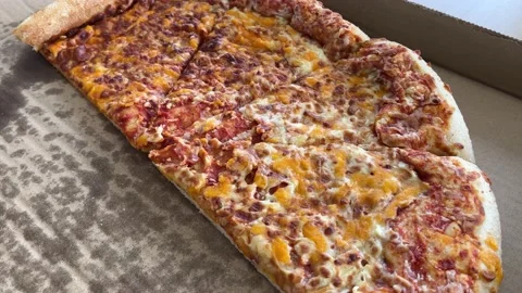 Half of large pizza in a box Stock Footage 233468572