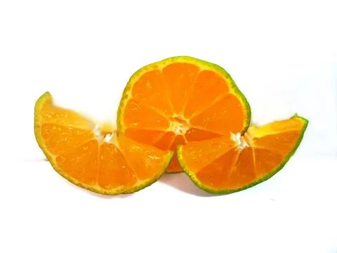 Half lemon and slice isolated on white background. orange peel is green Stock Photos