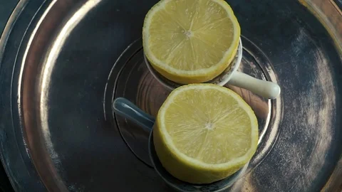Half lemon citrus fruit on tray background Video stock 106384353