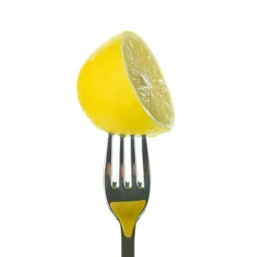 Half lemon on fork Stock Photos