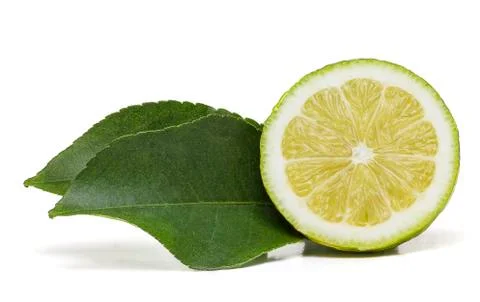 Half lemon fruit with two leaves on the side Stock Photos